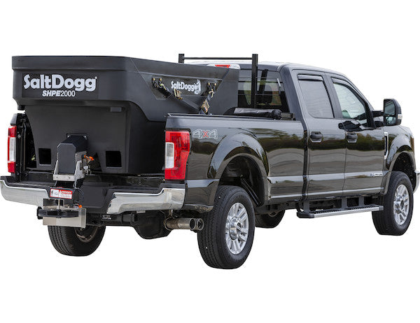SaltDogg SHPE2000 1600L hopper spreader on a Ford pickup, rear three-quarter view