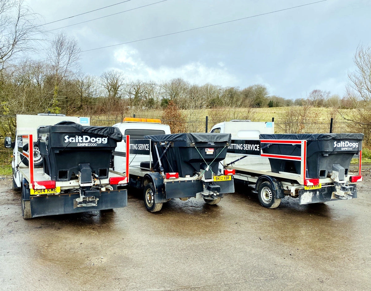Fleet of vehicles fitted with SaltDogg SHPE2000 1600L hopper salt spreaders