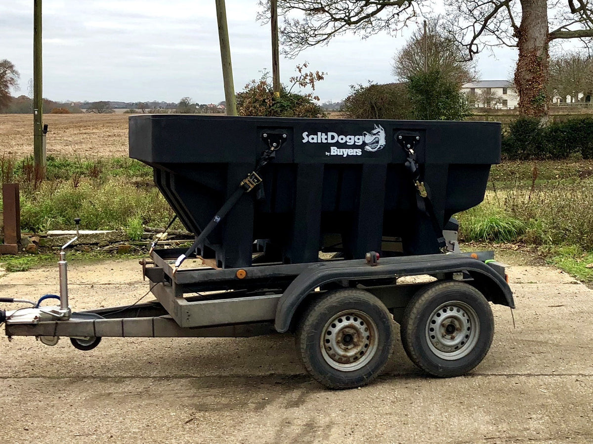 SaltDogg SHPE2000 1600L hopper salt spreader secured on a twin-axle trailer