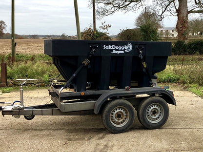 SaltDogg SHPE2000 1600L hopper salt spreader secured on a twin-axle trailer