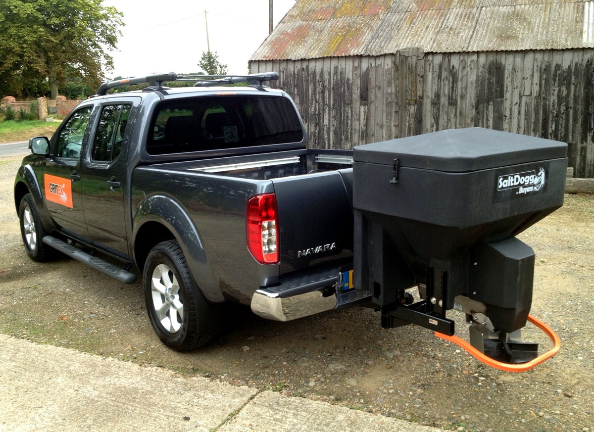 SaltDogg TGS03 230L tailgate salt spreader installed on Nissan Navara three-quarter view